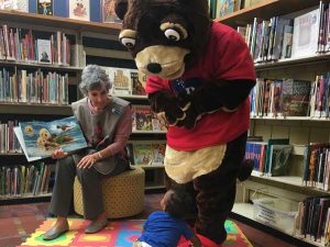 Ripple the otter makes an appearance at a children's story time