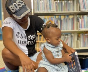 caretake and child together at a storytime