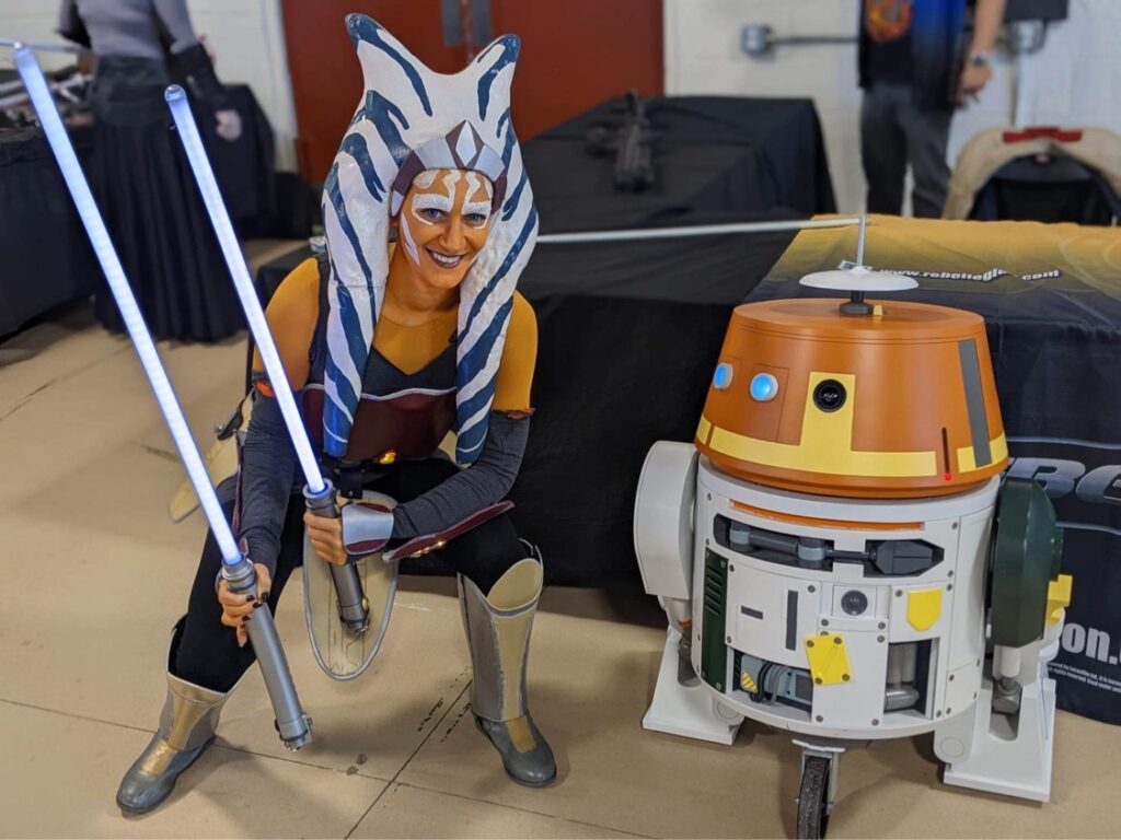 Me dressed as Ahsoka Tano from Star Wars: Rebels, pictured with the droid Chopper (or C1-10P) from the same series.