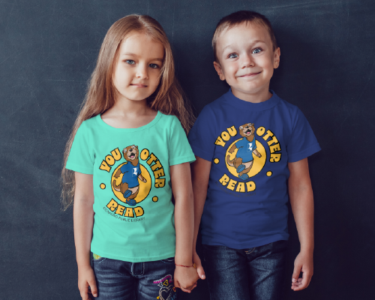 RPL NLW RippleMerch Two children wearing "You Otter Read" shirts featuring Ripple the Otter.