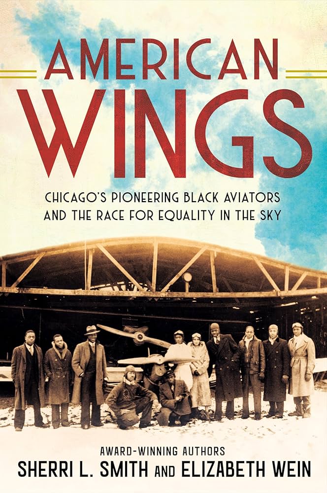 The image shows the cover of American Wings: Chicago's Pioneering Black Aviators and the Race for Equality in the Sky by Sherri L. Smith and Elizabeth Wein. The background is a sepia colored vintage photograph of Black aviators and men in long coats, some wearing hats. They are standing in front of an aircraft hangar and a plane. The text is in dark red and black. There is also a splash of blue across the sky. The book lists the authors as award-winning authors.