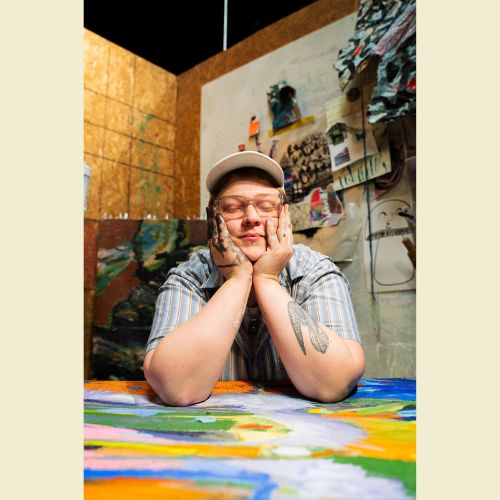 Photo of artist Troi Qualls in their studio.