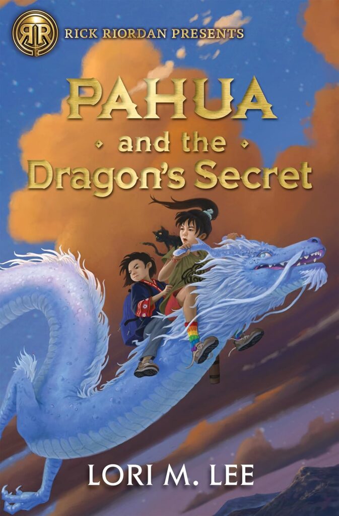 Book cover of "Pahua and the Dragon's Secret" by Lori M. Lee. Image shows two kids riding a blue dragon.
