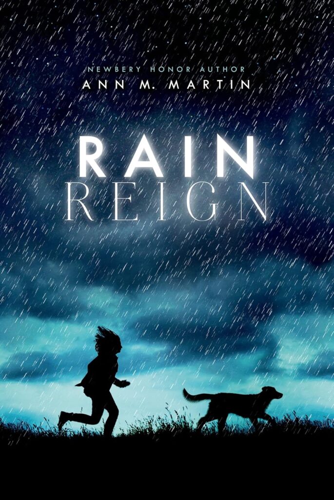 Cover of "Rain Reign" by Ann M. Martin. The cover shows a girl and a dog running through a field.