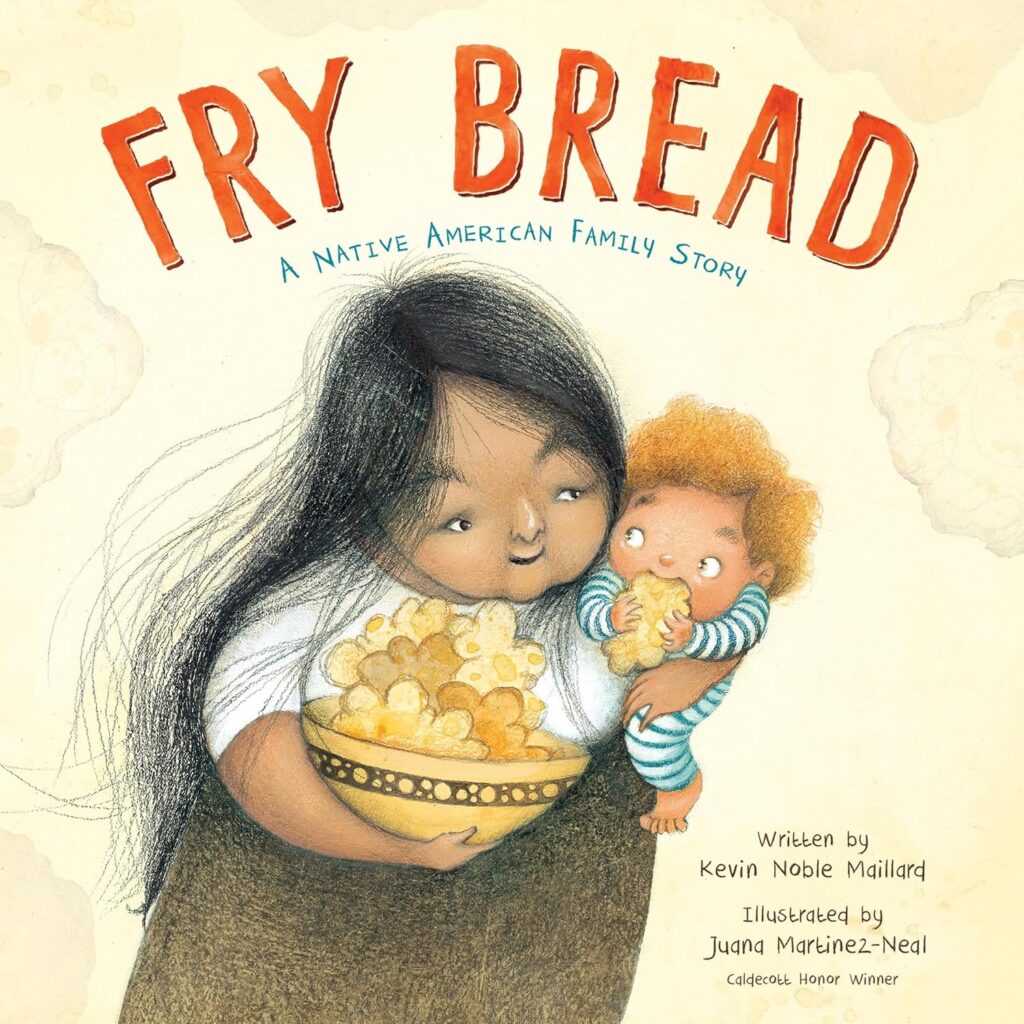 Cover of 'Fry Bread: A Native American Family Story' by Kevin Noble Maillard. Cover shows a woman holding a baby who is eating fry bread. 